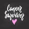 Cancer Survivor - hand drawn October Breast Cancer Awareness Month lettering phrase on black chalkboard background