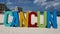 The Cancun sign at the summer on its turquoise beach