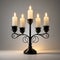 Candelabra with five lit candles