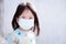 Candid children wear medical face mask to prevent the spread of the coronavirus disease (Covid-19).