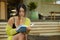 Candid lifestyle portrait of young beautiful and relaxed Asian Korean student girl on reading book or studying outdoors at coffee