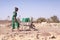 Candid photo of Aboriginal Woman Bringing fresh Water in a typical village