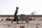 Candid photo of West Africa Women getting Tap Water in an arid zone