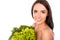Candid smiling woman with bag full of greens and vegetables
