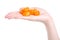 Candied dried kumquat in hand