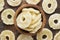 Candied fruit, rings pineapple in wooden bowl, top view