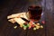 Candied fruits, cookies and cup of tea on a wooden table. Breakfast. Sweet candies