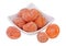 Candied kumquat on white background