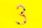 Candies font. Number 3 - three - on yellow background top view