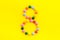 Candies font. Number 8 - eight - on yellow background top view