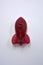 Candies, interesting rubber sweets in the form of red, cherry space rockets located on a white background.