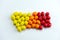 Candies  spread out gradient from yellow to red top view flat lay  on a white background