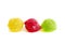 Candies, yellow, red and green sweets at white background