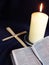 Candle, bible and palm crosses