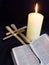 Candle, bible and palm crosses