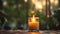 Candle burning on a wooden table with blurred background