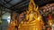 Candle Burns on the Background of the Statue Golden Buddha in Temple. Pattaya. Thailand