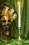 A candle in a candlestick near a Venetian mask on a green background