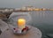 The candle and Chora port of Naxos at background, Greece