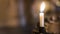 Candle in the church, praying with faith, traditional visit of a holy place for Easter, great Christian holiday, belief in God