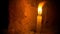 Candle closeup. Ancient Buddhist temple room