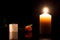 Candle in the darkness during All Saints Day