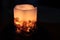 Candle - detail - seashells in wax, illuminated by light