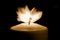 Candle flame in the dark background and space for text