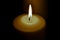 Candle flame in the dark background and space for text