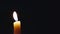 Candle flame in darkness