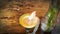 Candle flames on a vintage stand with a clear glass vase on the table