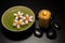 Candle and flowers bowl and black stone