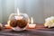 A candle in a glass vase, decoration and various interesting elements. Candles burning.