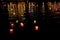Candle lanterns floating on a river among colorful reflections during night in Hoi An, Vietnam