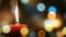 Candle light on defocused bokeh background