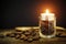 Candle light on group almond at wooden table. vintage image style and selective focus candle