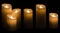 Candle Light, Three Wax Candles Lights on Black Background