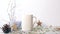 Candle lighting near white ceramic mug on the table with christmas decorations