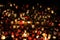 Candle lights on graves in cemetery at night on All Saints’ Day (All Souls’ Day, Halloween, Zaduszki)