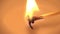 A candle is lit in slow motion