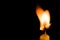 Candle with moving flame isolated on a black background