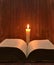 Candle and open book