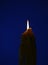 Candle with pattern and textured colourful shadowed background