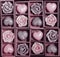Candle roses and candle hearts in wooden box
