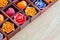 Candle roses and candle hearts in wooden box