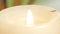 A candle on a table close-up