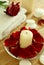 Candle, towel and petals of red rose