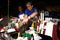 Candle vendors sell assorted colored prayer candles and herbal medicines at a store outside of a church