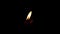 Candlelight against black background