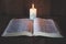 Candlelight provides light for Bible study Christian religious concepts, the crucifixion of faith and faith in God. Bible study
